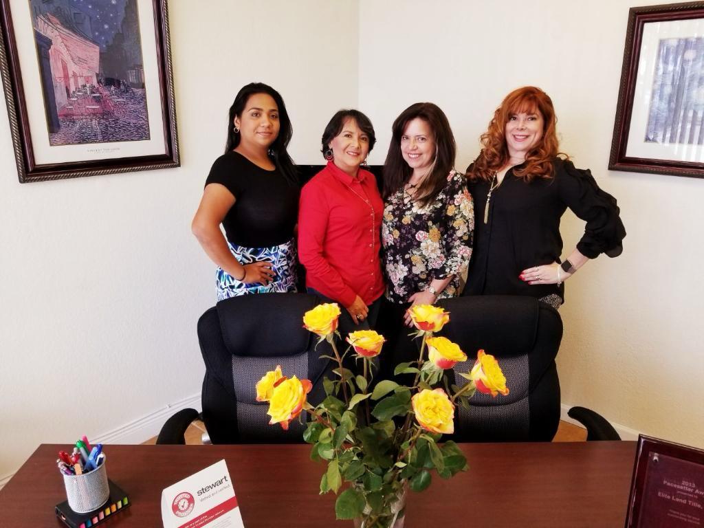 Elite Land Title team members in the office